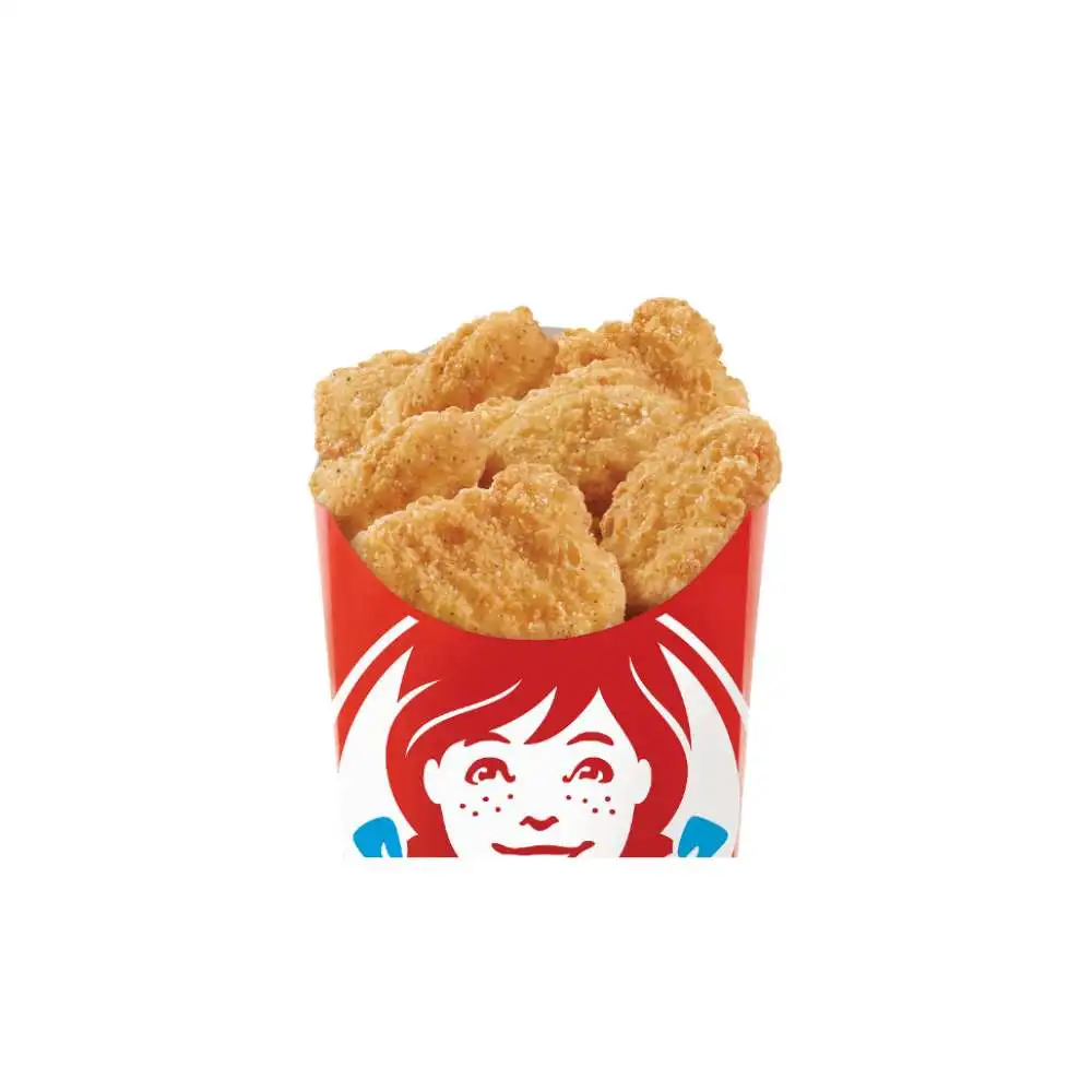 Wendy's Canada Crispy Chicken Nuggets – hot golden breaded all-white meat chicken bites overflowing in the iconic red Wendy's cup with smiling logo, juicy tender inside with perfect crunch, tasty fast food side or snack from the menu
