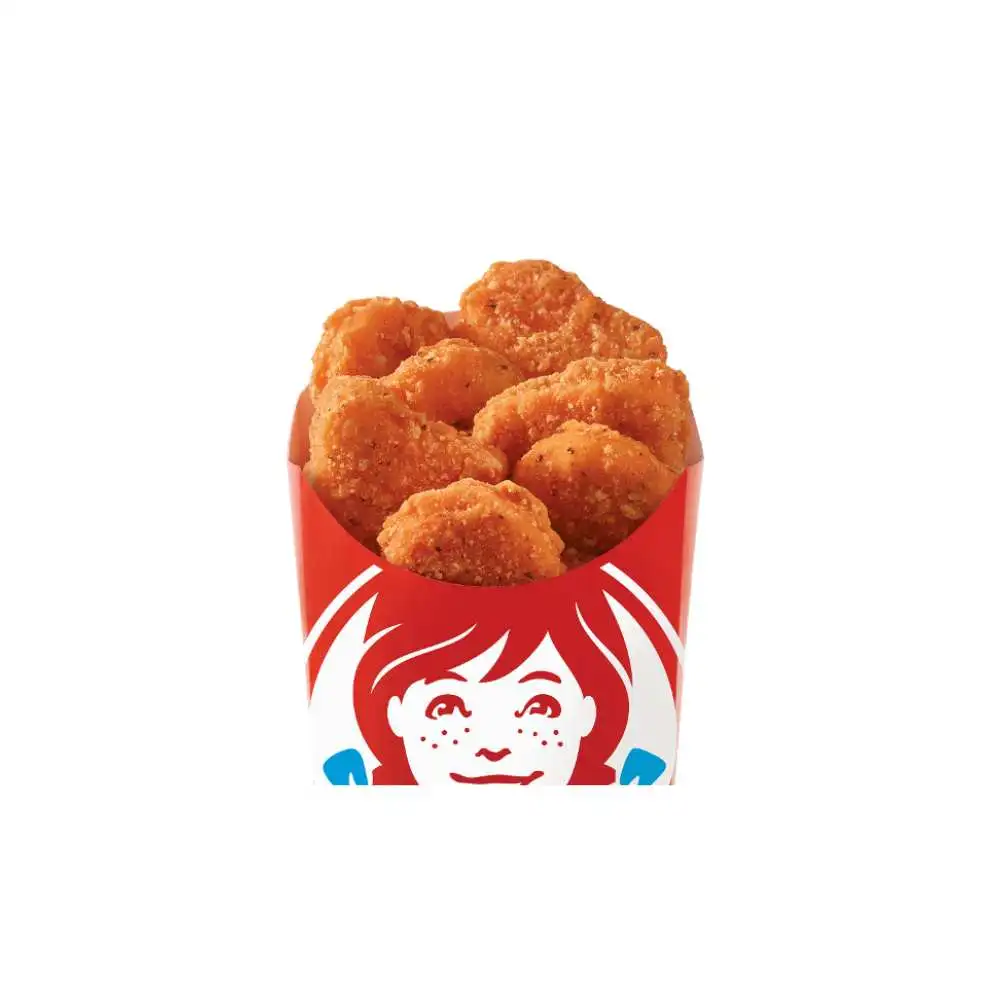 Wendy's Canada Crispy Chicken Nuggets – piping hot golden crispy breaded chicken bites piled high in the signature red cup featuring Wendy's smiling logo, made with juicy all-white meat chicken, ideal fast food snack or side from the value menu