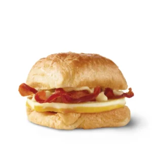 Classic beef burger with cheese lettuce tomato and pickles on a sesame seed bun