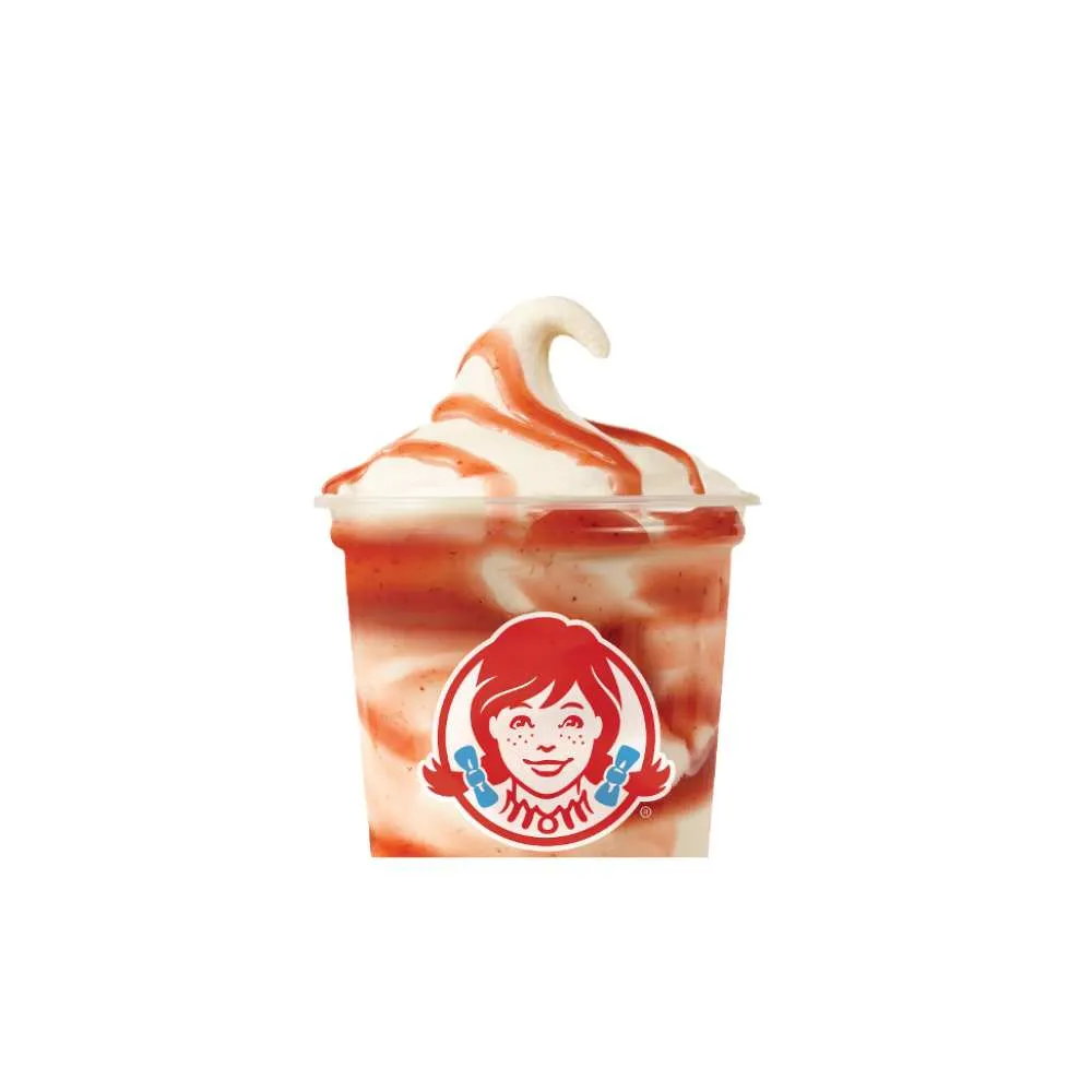Strawberry vanilla frosty swirl dessert in a Wendy's cup with strawberry sauce drizzle